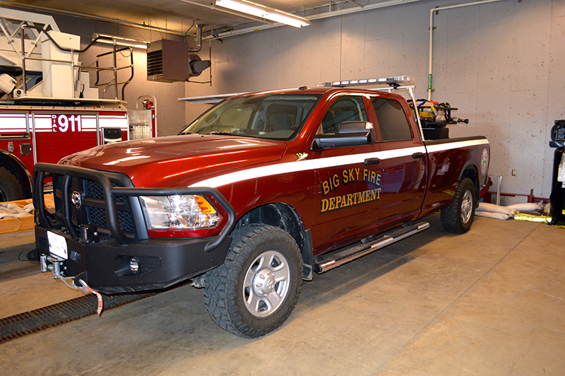wide view of brush 12-5 firetruck inside big sky firehouse garage