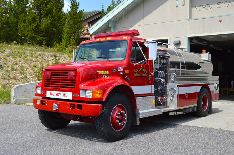 tender 12 firetruck outside the firehouse in big sky montana