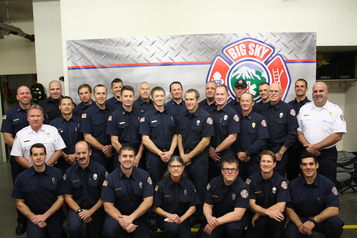 big sky fire department staff in front of fire truck
